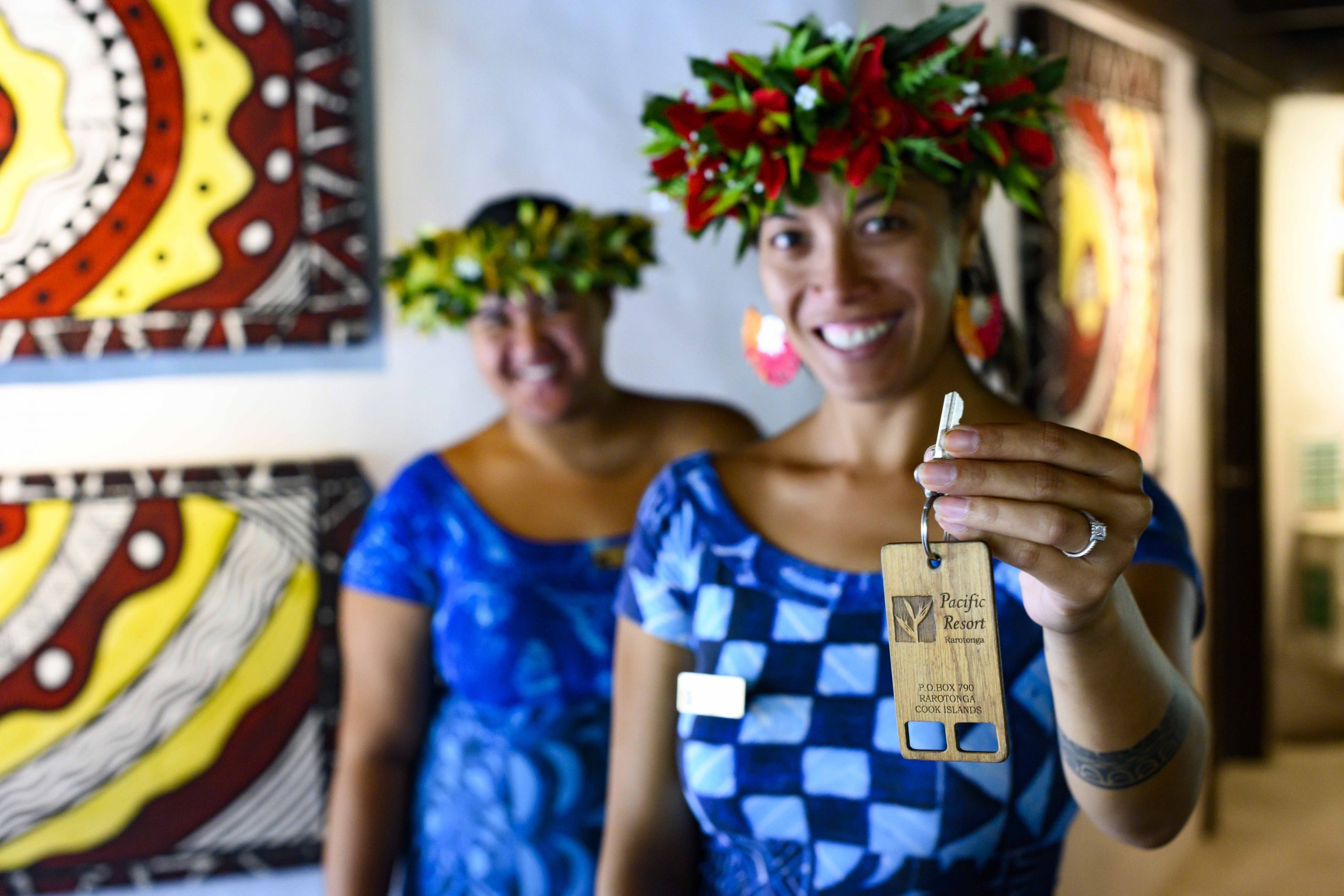 image of the Pacific Resort room key modelled by two beautiful Guest Services Agents