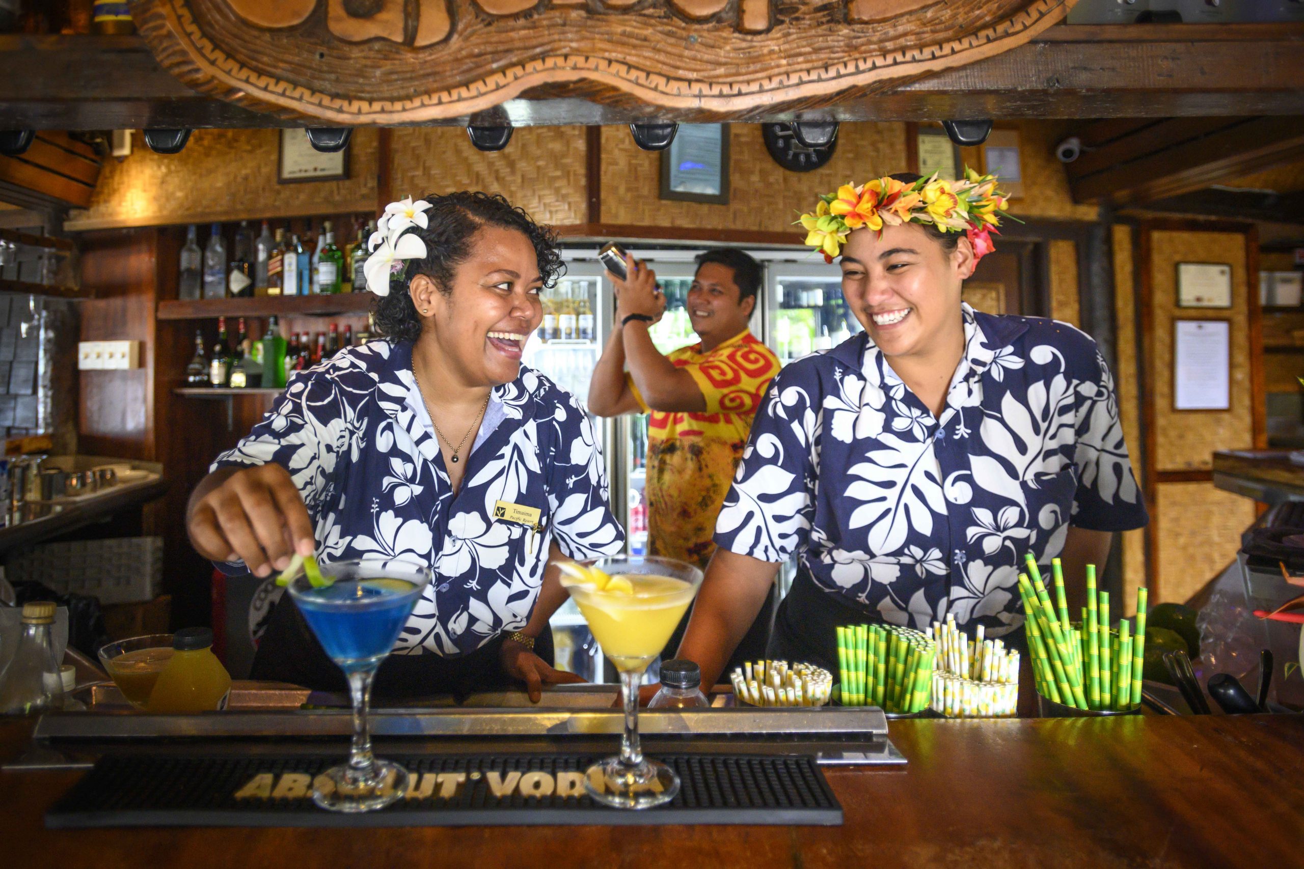 image of a friendly bartenders enjoy serving cocktail at Barefoot Bar