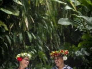 an image capturing two happy house keeping attendants proudly showcasing their housekeeping skills