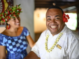 an image capturing two happy guest services agents smiling away, showcasing what Pacific Islanders are known for